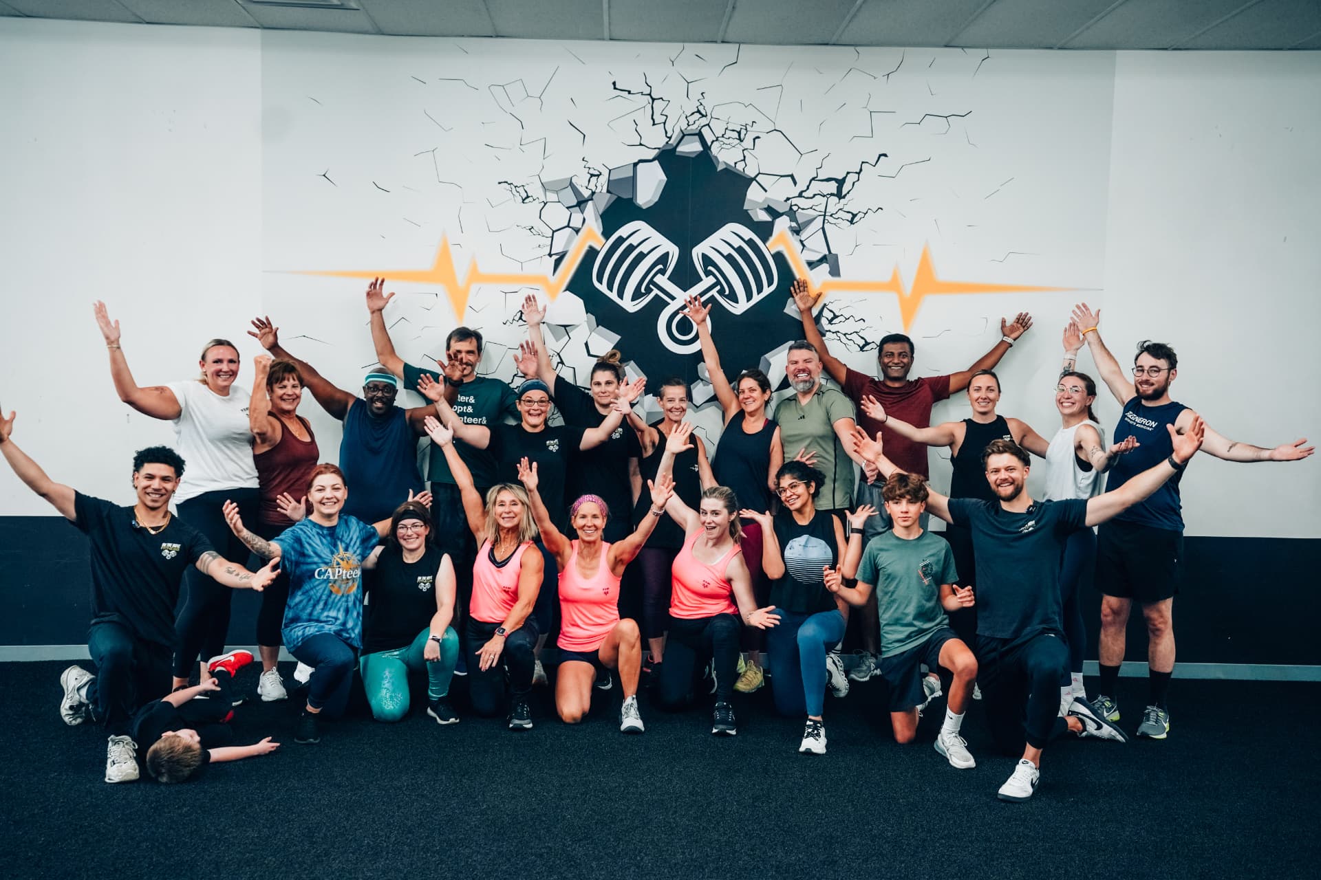 Members and coaches of On The Move Fitness gathered together in the gym