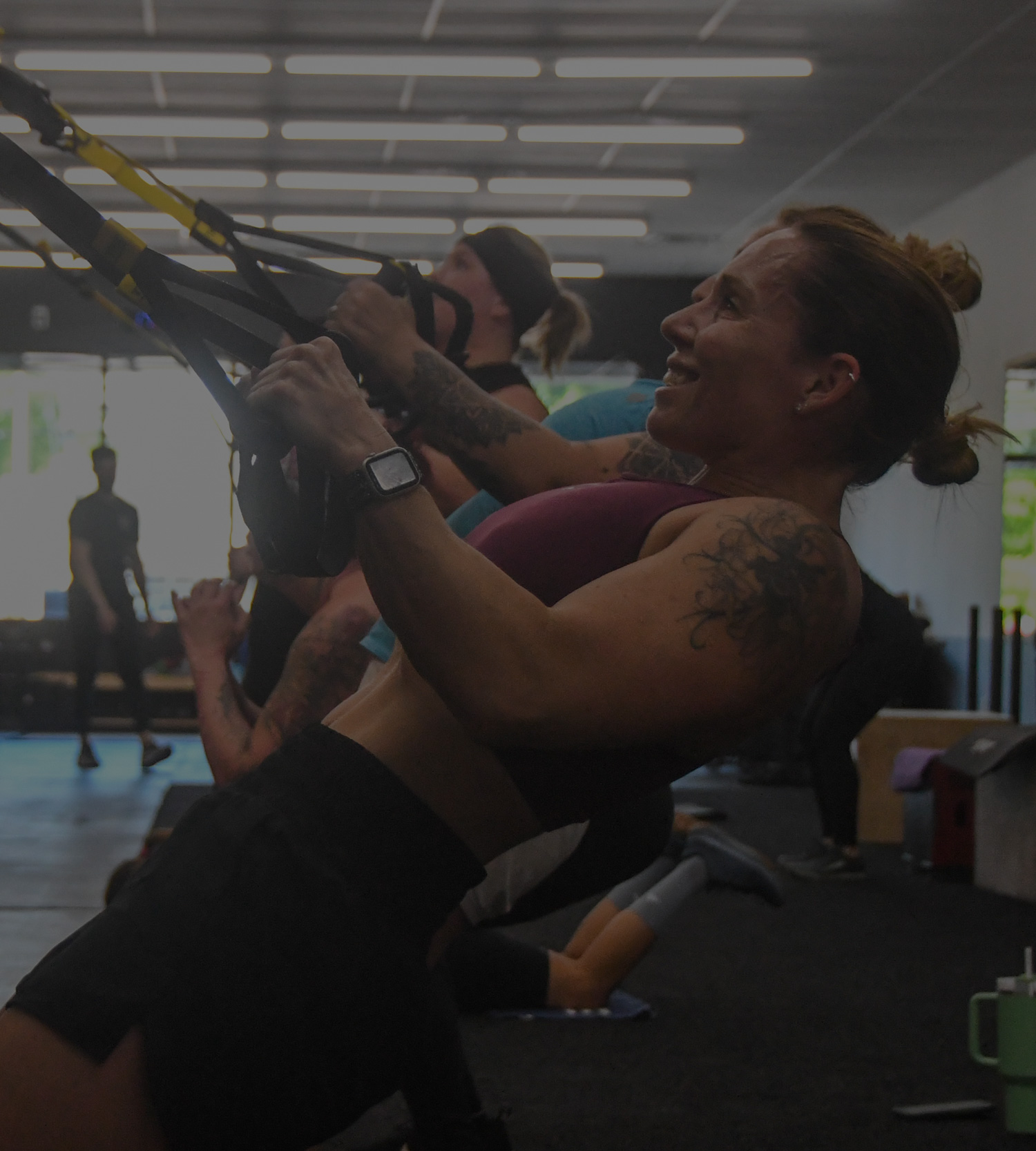 Coach leading an adult group strength session at On The Move Fitness in Clifton Park, New York